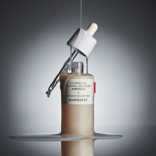 ProtoClinical k-beauty RAWQUEST Echinacea Calming Moisture Ampoule 50ml as a single centered ampoule bottle silhouette with dark charcoal and warm beige tones on a light background