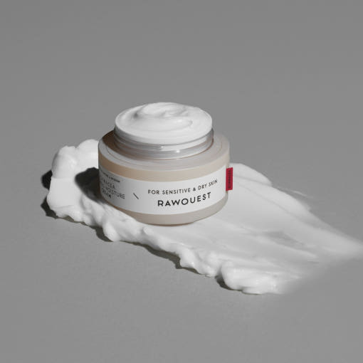 ProtoClinical k-beauty warm gray beauty product silhouette with a soft pale vertical form on a dark background.