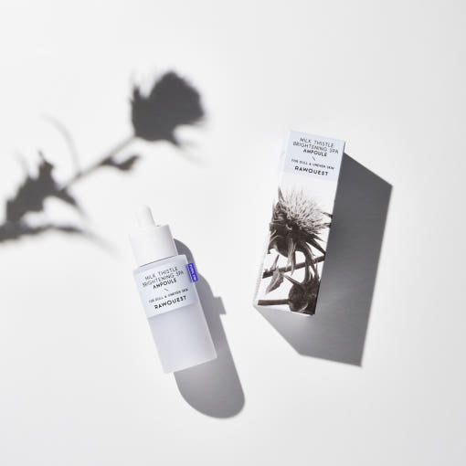 ProtoClinical k-beauty pale lavender beauty detail with a dark taupe vertical center on a light background.