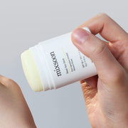 ProtoClinical k-beauty beige beauty bottle silhouette with soft blue upper accents on a light background.