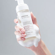 ProtoClinical k-beauty soft warm beige beauty product silhouette on a muted blue-gray background.