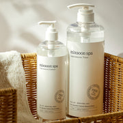 ProtoClinical k-beauty blue and beige product packaging with a dark brown lower section on a light background.