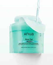 ProtoClinical k-beauty Anua PDRN 100 Hyaluronic Acid Glow Pad 60P/180ml single deep teal vertical product silhouette centered on a pale aqua background with soft pink side tones