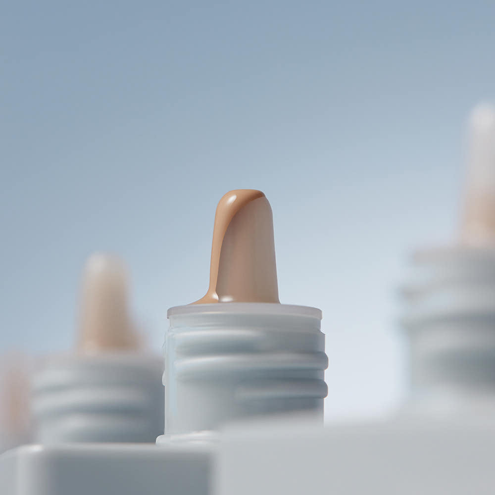 ProtoClinical k-beauty cool gray vertical beauty product on a light background.