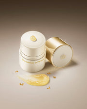 ProtoClinical k-beauty [THE WHOO] Royal Essential Golden Lipcerin 15ml single gold lip balm container angled on a cream background with a dark brown top band