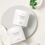ProtoClinical k-beauty nooni Daily Turnover Peel Pad 145ml square peel pad pack graphic with gray-white packaging shapes and soft neutral background