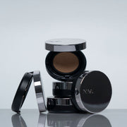 ProtoClinical k-beauty dark charcoal beauty product silhouette on a pale blue-gray background.