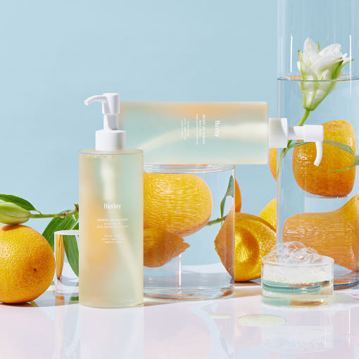 ProtoClinical k-beauty blue and beige beauty graphic with a soft yellow center on a light background.