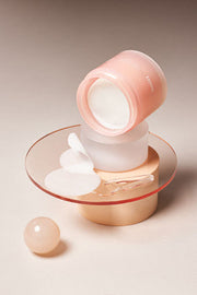 ProtoClinical k-beauty warm beige beauty graphic with a dark brown vertical product silhouette on a light background.