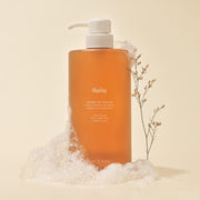 ProtoClinical k-beauty warm beige beauty product silhouette with a dark caramel center on a pale blue and cream background.