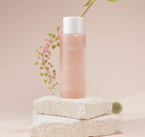 ProtoClinical k-beauty cosmetic graphic in soft pink and cream tones on a light background.