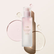 ProtoClinical k-beauty taupe beauty bottle with a darker base on a light peach background.