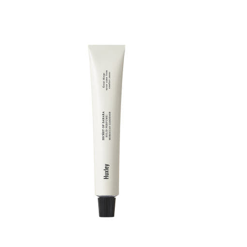 ProtoClinical k-beauty beauty product silhouette with soft peach and beige tones on a light background.