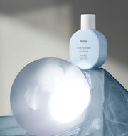 ProtoClinical k-beauty abstract gray-blue beauty graphic with a soft bright center.