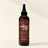 ProtoClinical k-beauty JUNGSAEMMOOL Salon.Zip Scalp Renewing Water Treatment 200ml warm brown bottle silhouette with soft cream side bands on a light background.