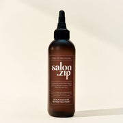 ProtoClinical k-beauty JUNGSAEMMOOL Salon.Zip Scalp Renewing Water Treatment 200ml warm brown bottle silhouette with soft cream side bands on a light background.