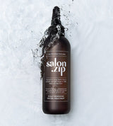 ProtoClinical k-beauty JUNGSAEMMOOL Salon.Zip Scalp Renewing Water Treatment 200ml deep gray bottle silhouette with pale blue side bands on a light background.