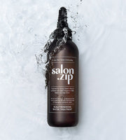 ProtoClinical k-beauty JUNGSAEMMOOL Salon.Zip Scalp Renewing Water Treatment 200ml deep gray bottle silhouette with pale blue side bands on a light background.