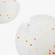 ProtoClinical k-beauty NEOGEN Dermalogy Double Vita Capsule Cleansing Foam 160g shown as translucent gel bubbles with yellow and orange capsule beads on a white background
