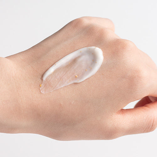ProtoClinical k-beauty soft pink beauty product detail on a light background.