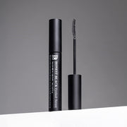 ProtoClinical k-beauty Benton Honest Black Eyelash Serum 8ml model portrait holding the black eyelash serum tube against a soft gray background