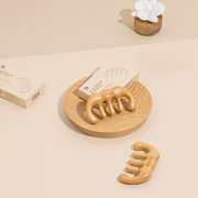 ProtoClinical k-beauty warm beige beauty packaging arranged on a soft cream background.