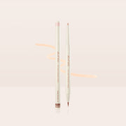 ProtoClinical k-beauty [TOO COOL FOR SCHOOL] Artclass Glam Under Liner 0.2g/0.7g (4 Colors) two cream liner pens standing upright on a pale peach reflective surface with a soft peach swatch behind them