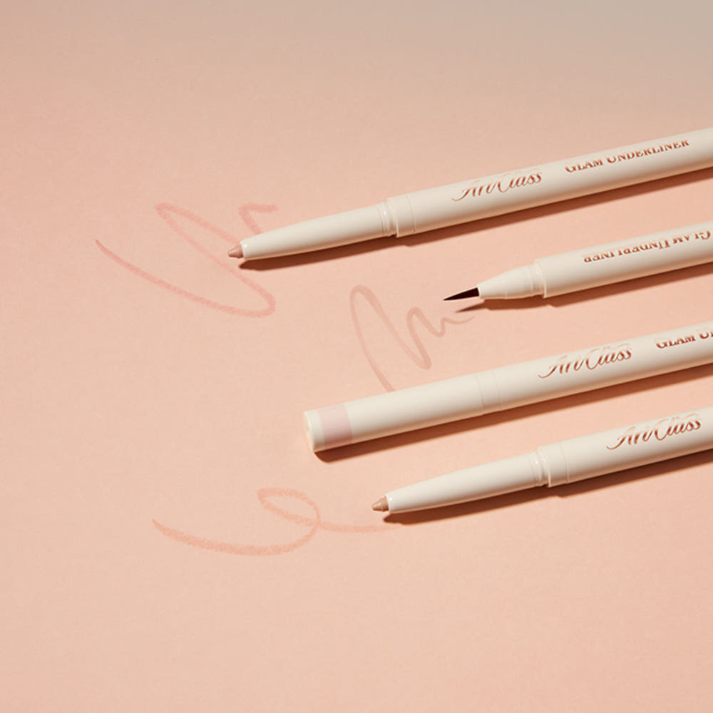 ProtoClinical k-beauty [TOO COOL FOR SCHOOL] Artclass Glam Under Liner 0.2g/0.7g (4 Colors) four cream liner pens laid diagonally on a peach background with one fine brush tip, two beige pencil tips, and soft swatch marks