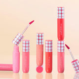 ProtoClinical k-beauty [TOO COOL FOR SCHOOL] Glossy Blaster Tint 3.4g (9colors) set with upright pink and coral lip tint tubes, plaid caps, and two open applicators on a peach background