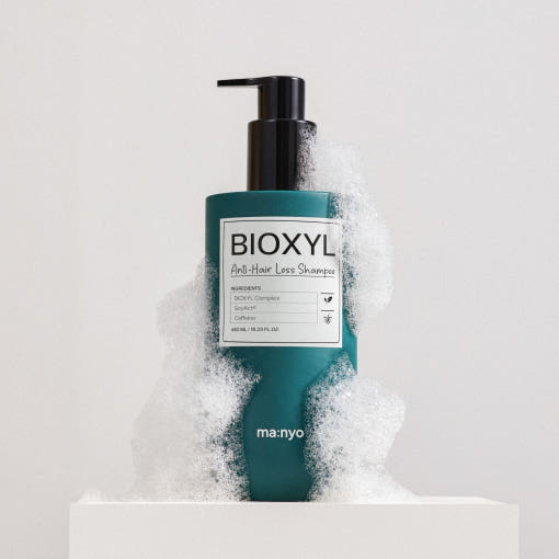 ProtoClinical k-beauty muted green beauty product silhouette with pale side panels on a light background.