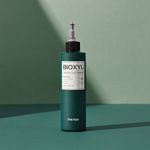 ProtoClinical k-beauty [MANYO FACTORY] BIOXYL Anti-Hair Loss Treatment 200ml with a muted teal product silhouette on a dark background