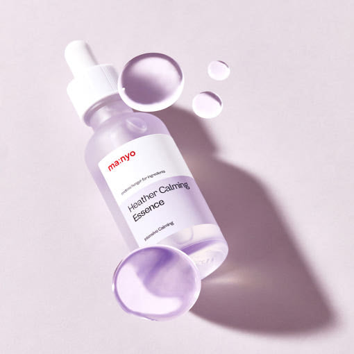 ProtoClinical k-beauty [MANYO FACTORY] Heather Calming Essence 50ml shown as an abstract pale lavender graphic panel with a soft gray vertical accent and darker lower bands on a light background.