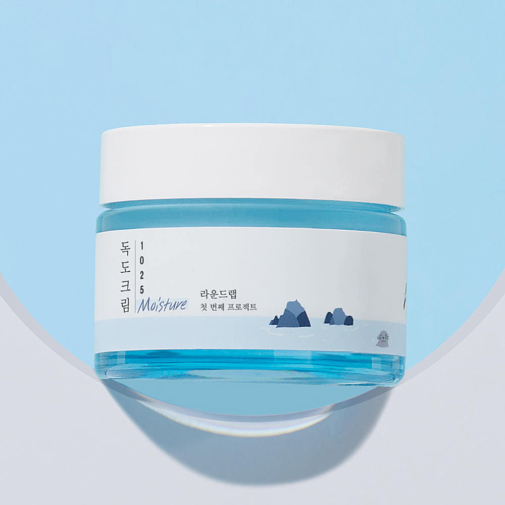 ProtoClinical k-beauty abstract beauty graphic with a soft blue field on a light background.