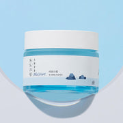 ProtoClinical k-beauty abstract beauty graphic with a soft blue field on a light background.