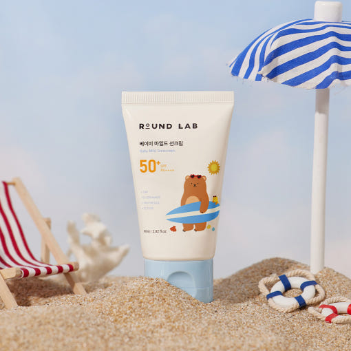 ProtoClinical k-beauty Round Lab Baby Mild Sun Cream SPF 50+ PA++++ 60ml single upright pale green sun cream tube centered on a white background with soft blue lower corners.