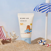ProtoClinical k-beauty Round Lab Baby Mild Sun Cream SPF 50+ PA++++ 60ml single upright pale green sun cream tube centered on a white background with soft blue lower corners.