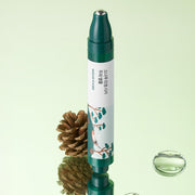 ProtoClinical k-beauty dark olive beauty product silhouette on a pale green background.