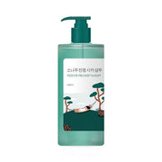 ProtoClinical k-beauty teal beauty product silhouette with soft pink side accents on a pale background.
