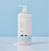 ProtoClinical k-beauty abstract beauty graphic with a pale blue field on a light background.