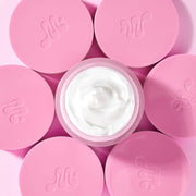 ProtoClinical k-beauty pink beauty visual with a soft white center on a light background.