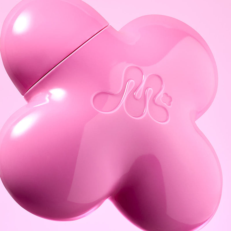 ProtoClinical k-beauty rose beauty product detail with deeper pink side and lower accents on a rose-toned background.