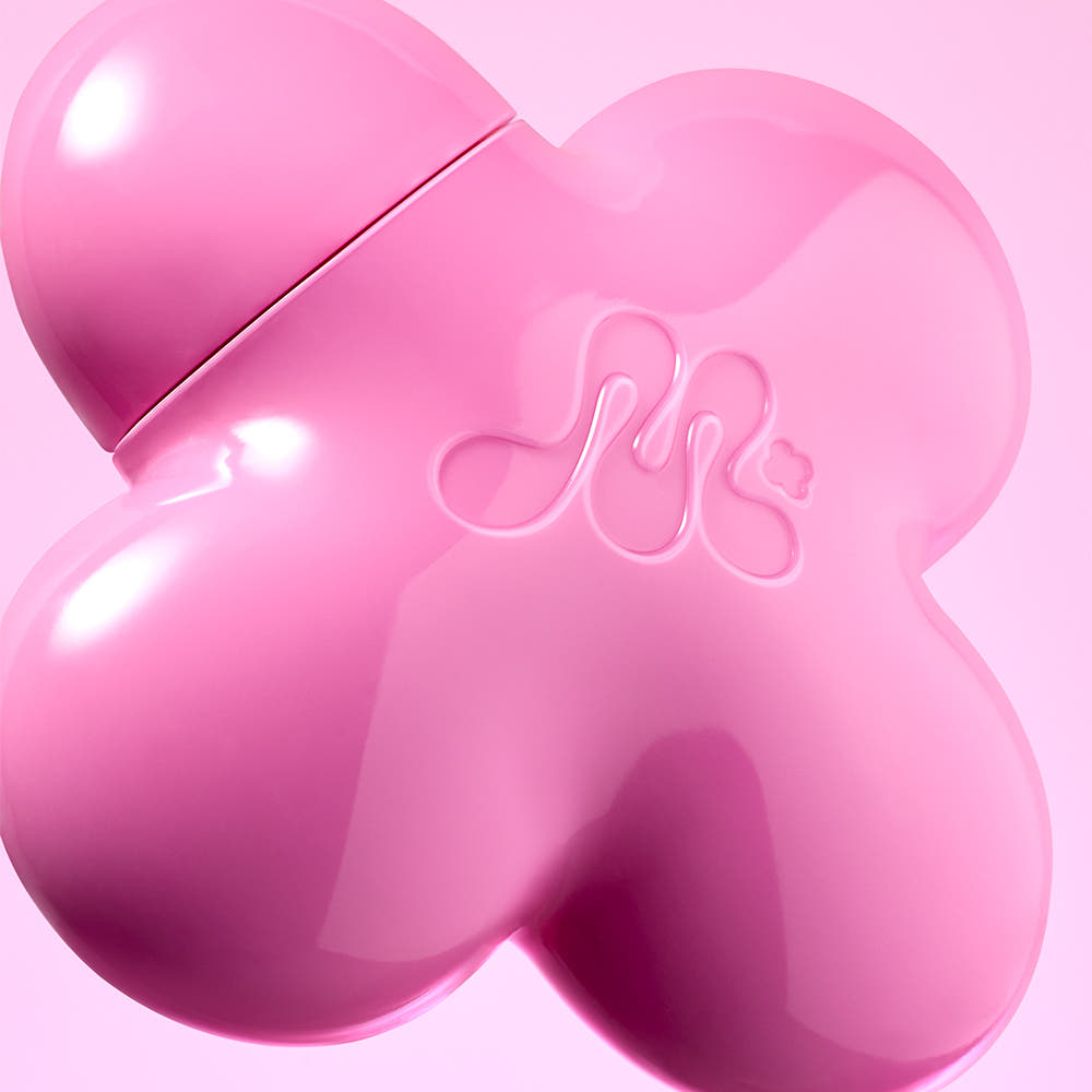 ProtoClinical k-beauty rose beauty product detail with deeper pink side and lower accents on a rose-toned background.