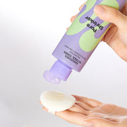 ProtoClinical k-beauty pastel yellow and lavender beauty visual with a soft beige base on a light background.