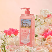 ProtoClinical k-beauty BIOKLASSE MILK BAOBAB Hair Shampoo 1000ml #Flora Bouquet single upright pink shampoo bottle centered on a peach background with warm cream side tones.