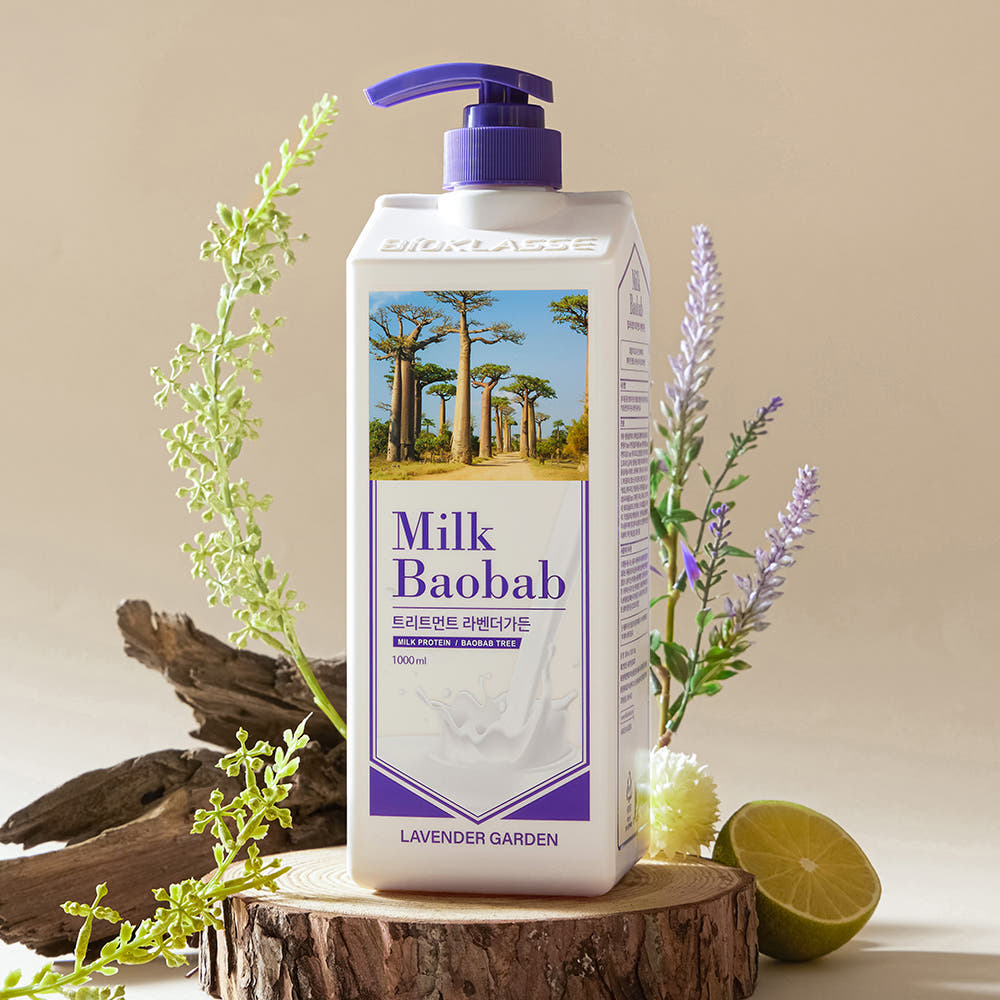 ProtoClinical k-beauty BIOKLASSE MILK BAOBAB Hair Treatment 1000ml #Lavender Garden single upright lavender-gray hair treatment bottle centered on a warm beige background