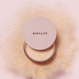 ProtoClinical k-beauty coral cosmetic product packaging on a light beige background.