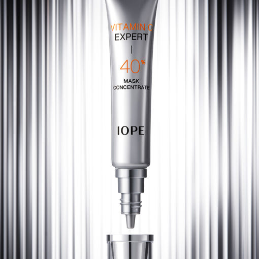 ProtoClinical k-beauty IOPE Vitamin C Expert 40% Mask Concentrate 15g slim gray package on a dark gray and pale pink background