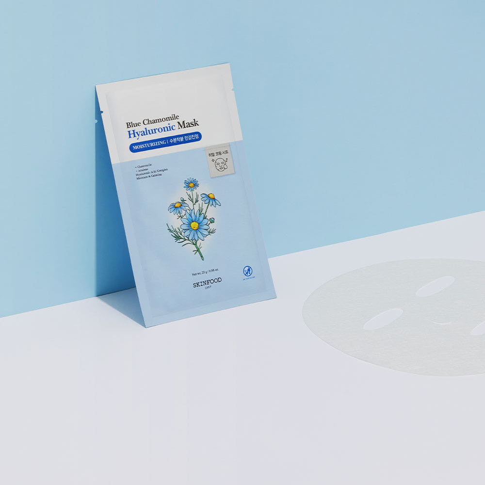 ProtoClinical k-beauty SKINFOOD Blue Chamomile Hyaluronic Mask Sheet 25g X 10ea single pale blue rectangular mask packet with a peach-toned upper panel centered on a light background
