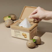 ProtoClinical k-beauty SKINFOOD Potato Madecassoside Daily Mask Sheet 270g/30ea open beige mask tub with one sheet being pulled upward, surrounded by whole potatoes on a tan background