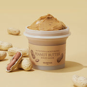 ProtoClinical k-beauty SKINFOOD Peanut Butter Food Mask 120g single brown mask jar centered on a warm beige background with soft peach shading